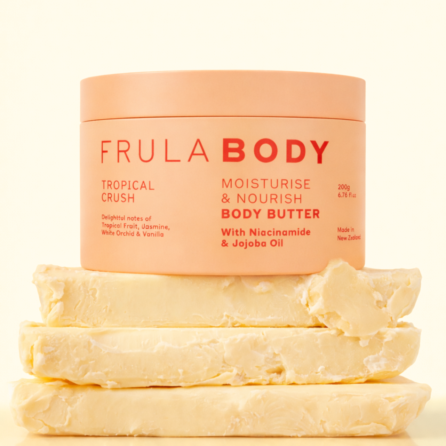 Frula Body moisturizing body butter with tropical crush scent on a beige background